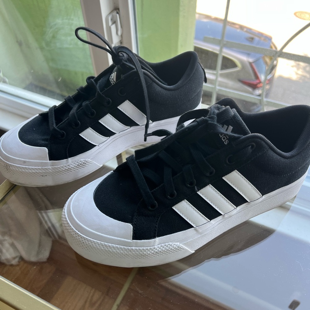Adidas Black and White Athletic Shoes with Striking Stripes
